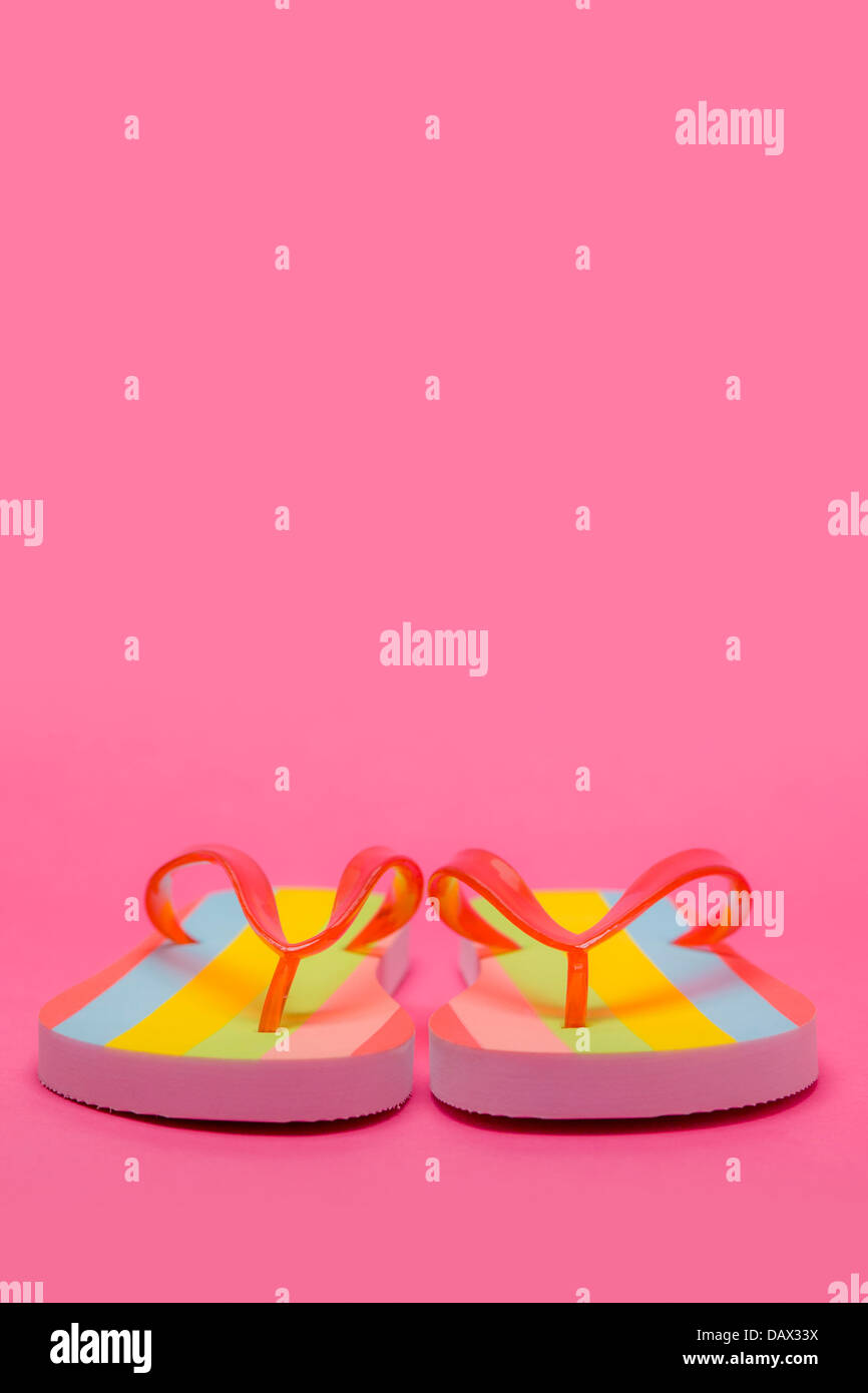 Pair of Flip flops on pink background Stock Photo - Alamy