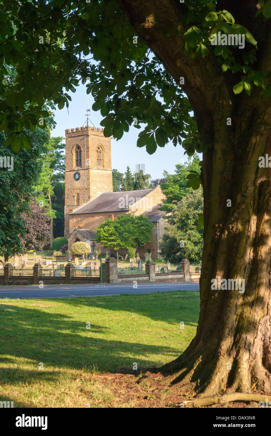 View through the trees of St Peter and Paul Church Abington Park Northampton Stock Photo