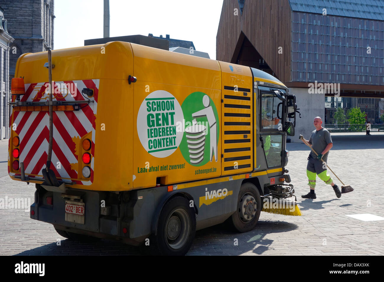 Street sweeper / street cleaner cleaning the streets in the city center of Ghent, Belgium Stock Photo