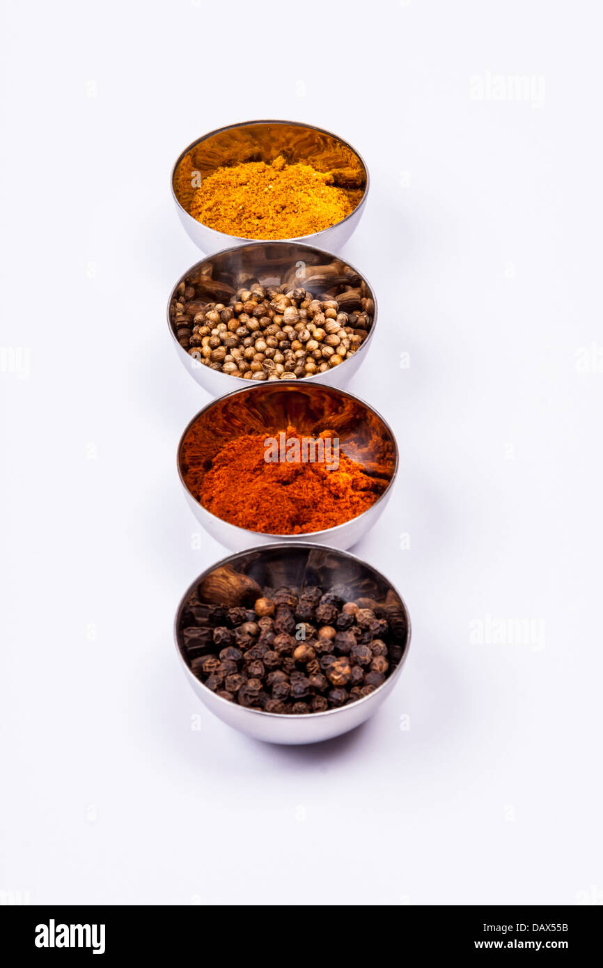 Curry, pepper, paprika and coriander on white background Stock Photo
