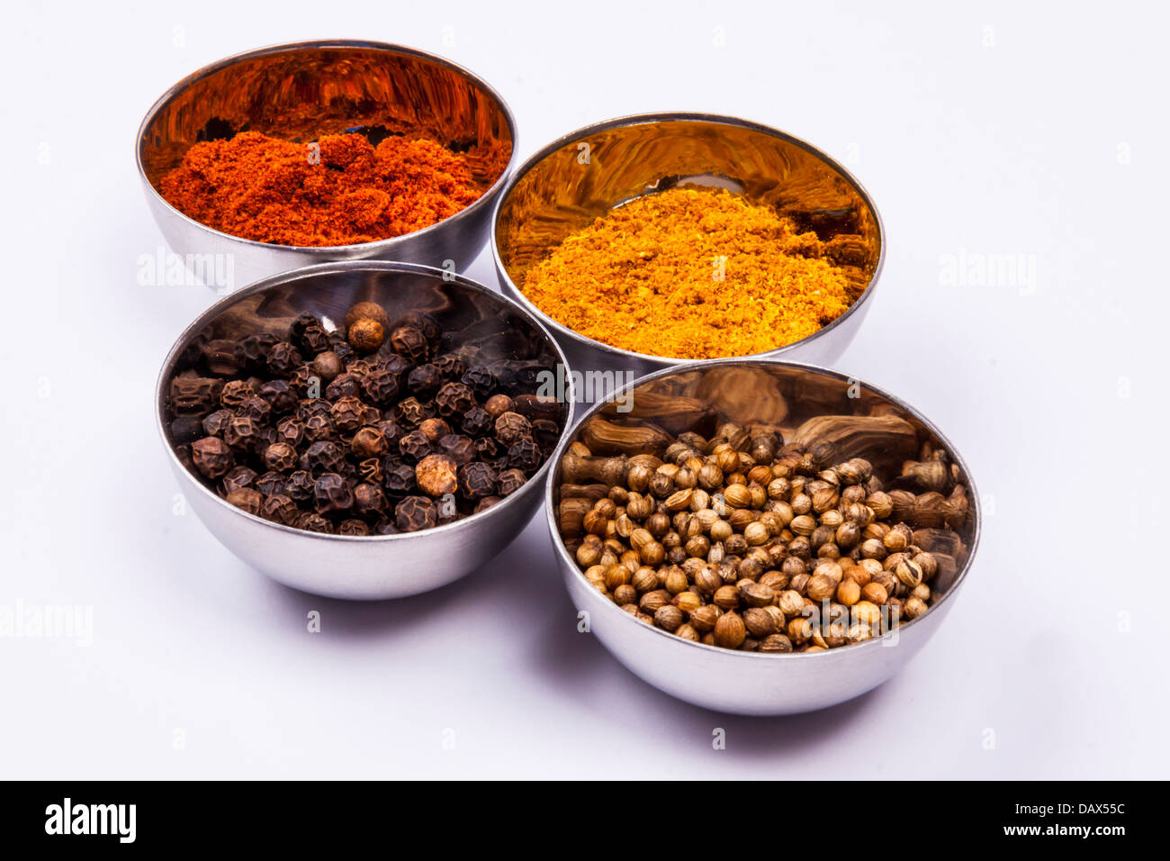 Curry, pepper, paprika and coriander on white background Stock Photo