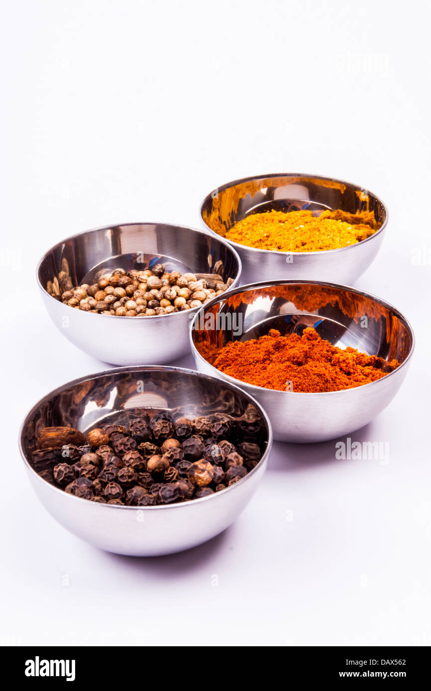 Curry, pepper, paprika and coriander on white background Stock Photo