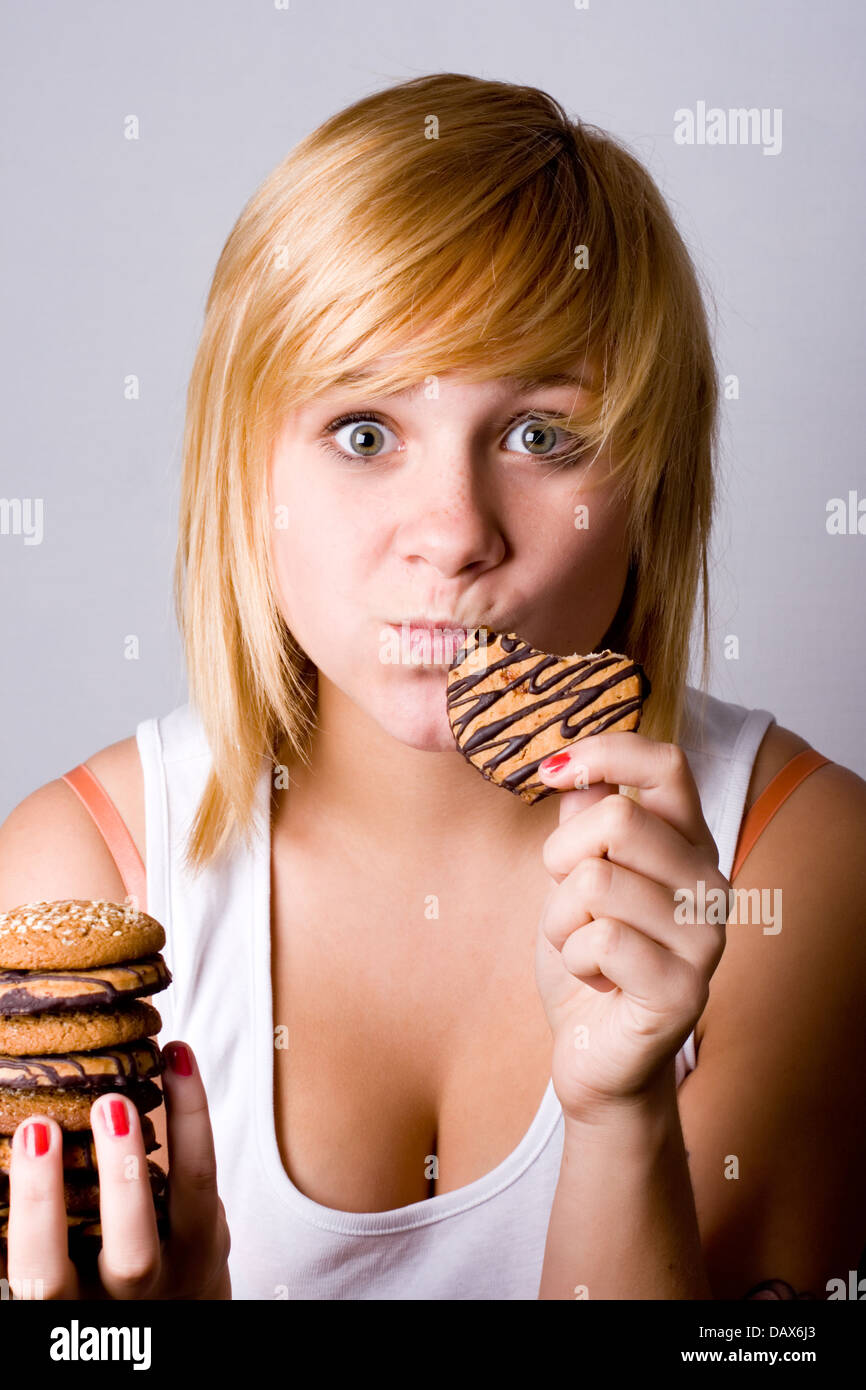 woman eating chocolate chip cookies Stock Photo - Alamy