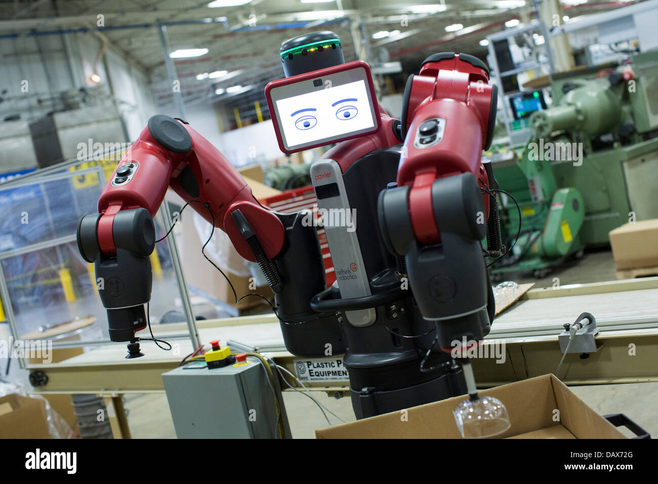 Baxter the robot made by Rethink Robotics at the Rodon Group plastic molding factory.  Stock Photo