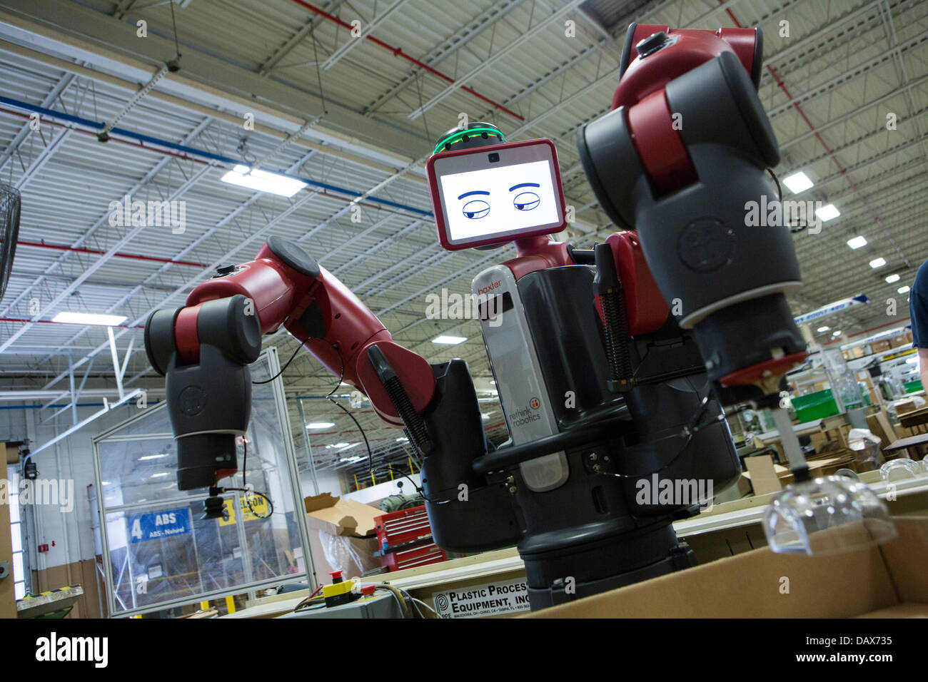 Baxter the robot made by Rethink Robotics at the Rodon Group plastic molding factory.  Stock Photo