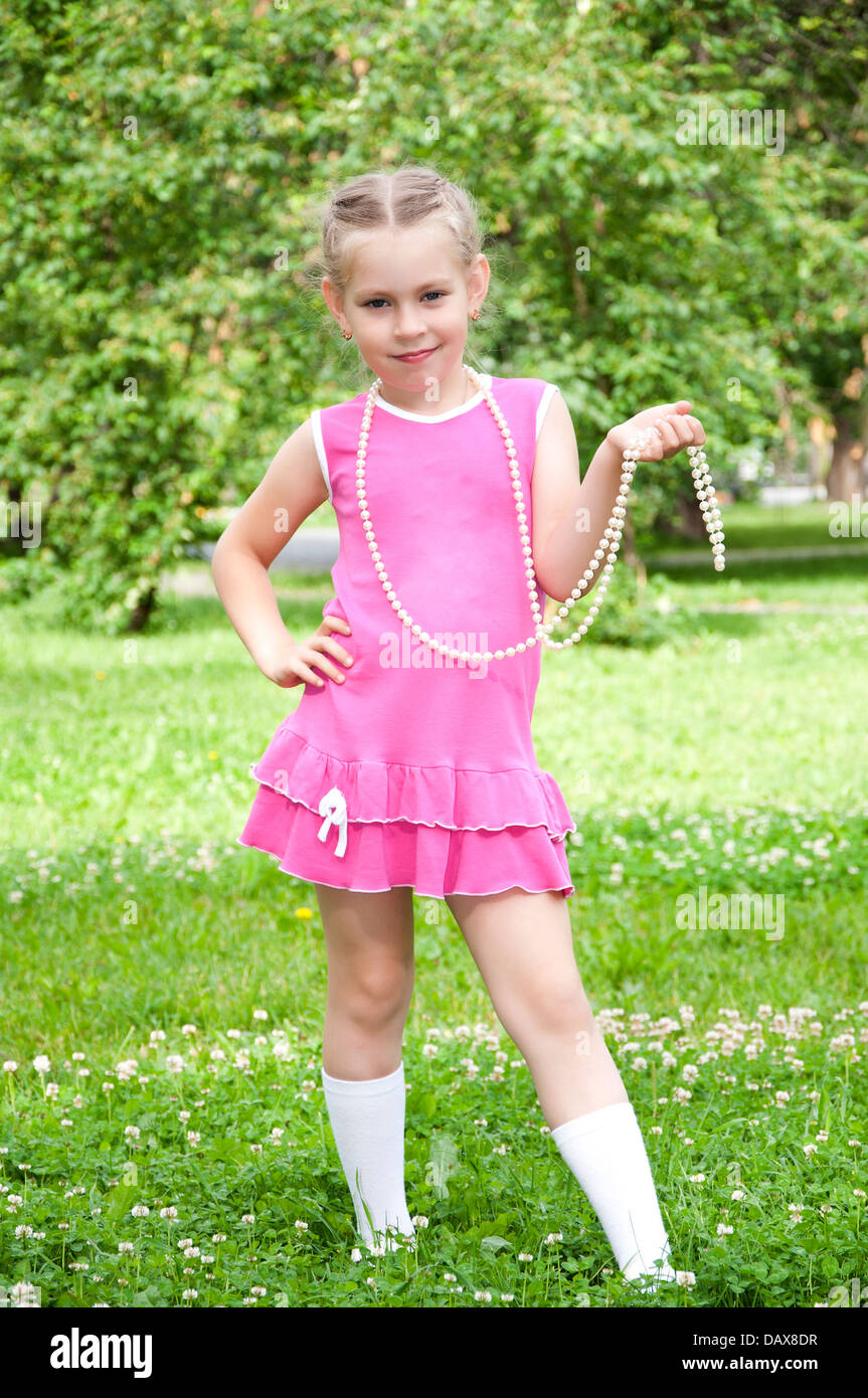 portrait of a young blond girl in pink dress Stock Photo - Alamy