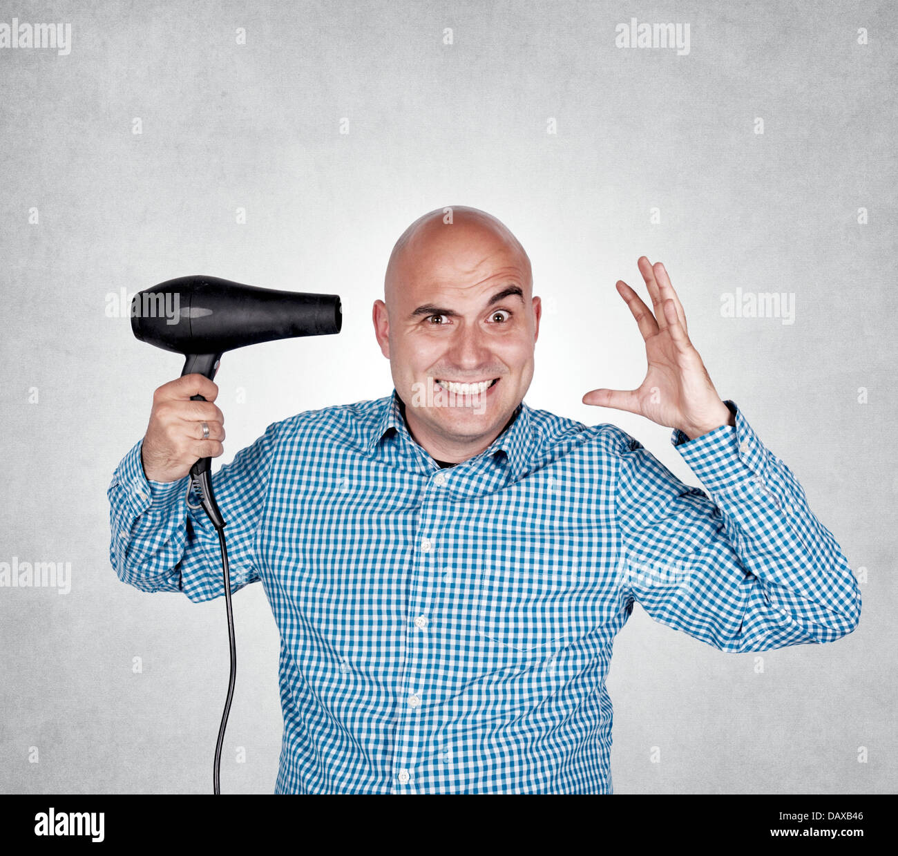 Bald guy holding hair dryer hires stock photography and images Alamy