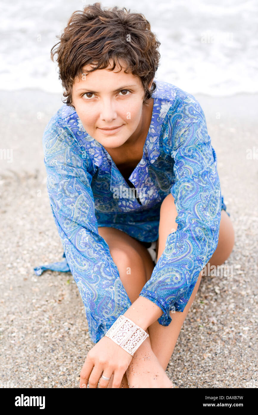 woman in blue dress on the beach Stock Photo - Alamy