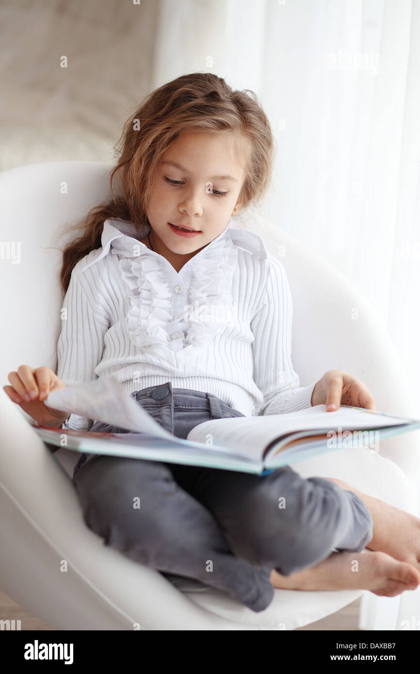 Child reading a book Stock Photo Alamy
