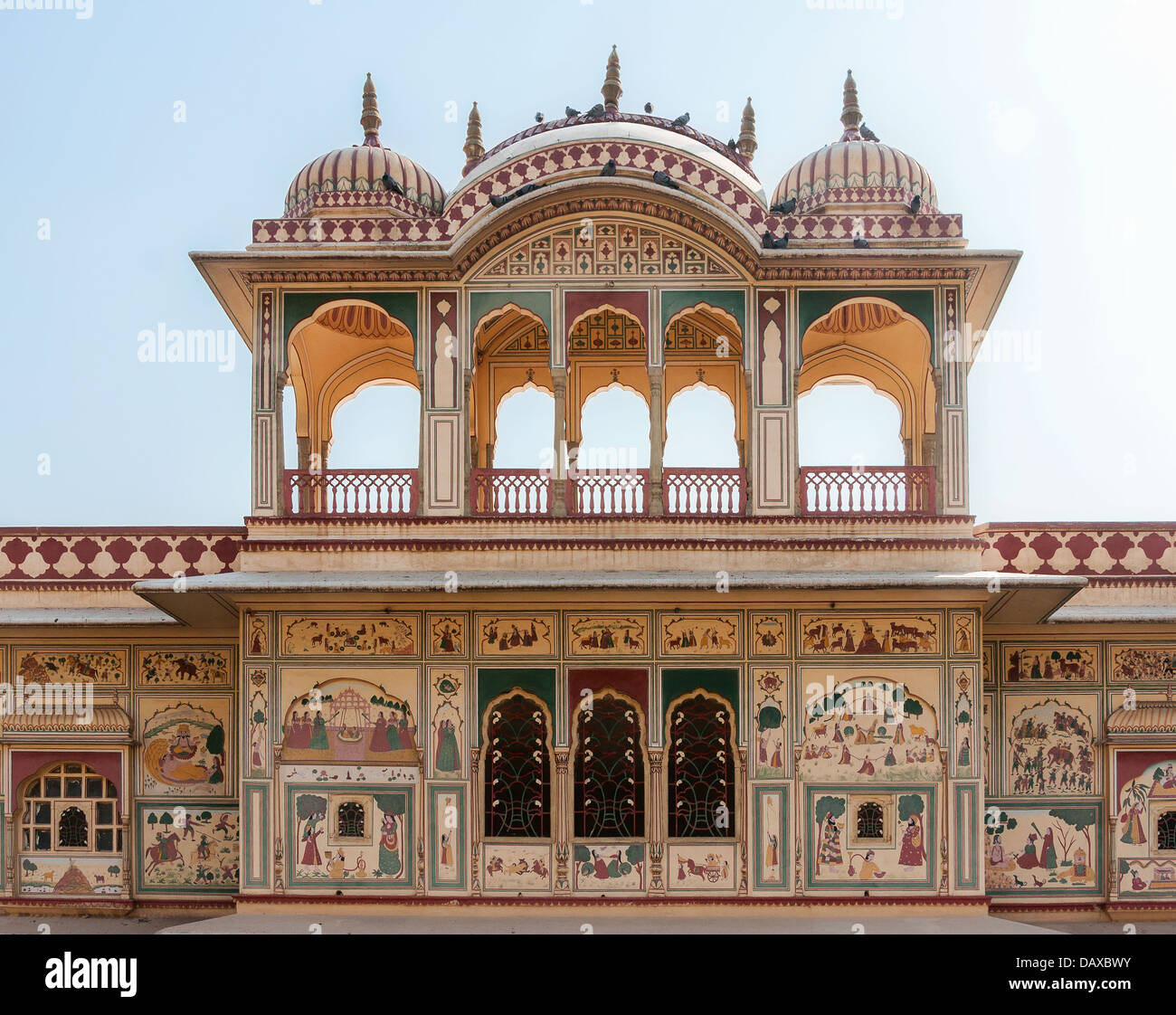 Domed upper structure with wall paintings on mansion outside India's Jaipur. Stock Photo