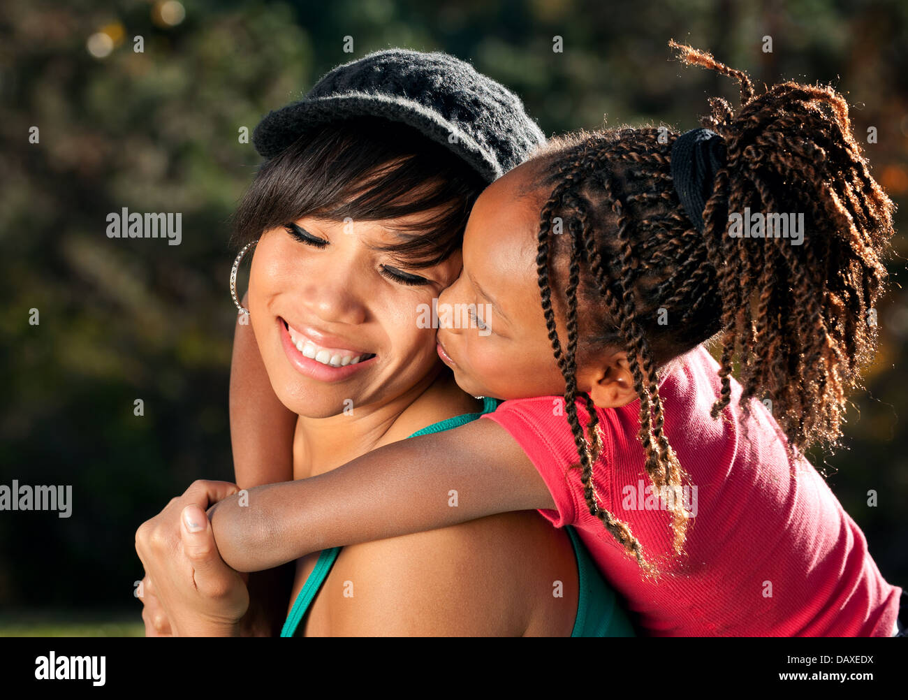 African American mother and child having fun spending time together in a park Stock Photo