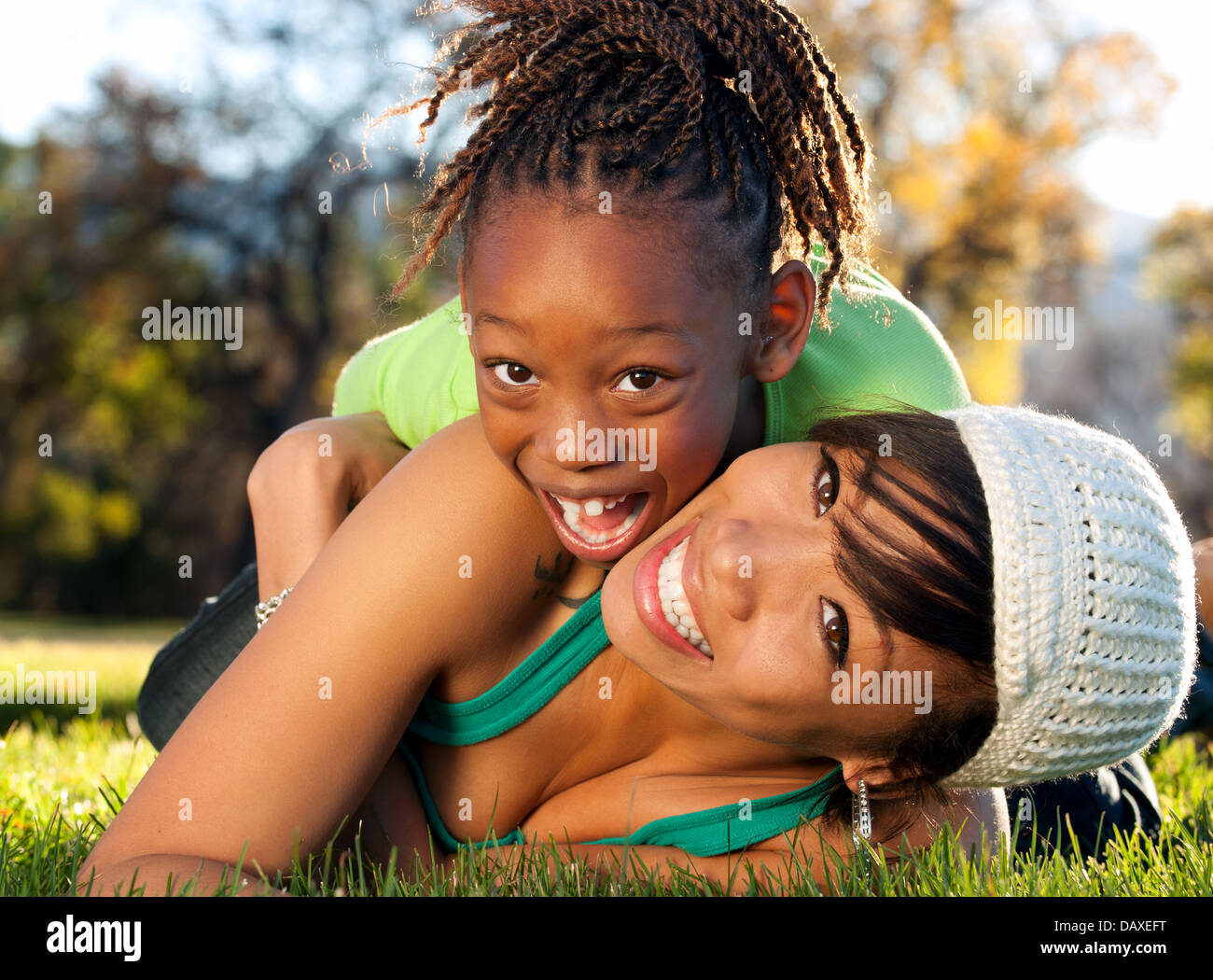 African American mother and child having fun spending time together in a park Stock Photo