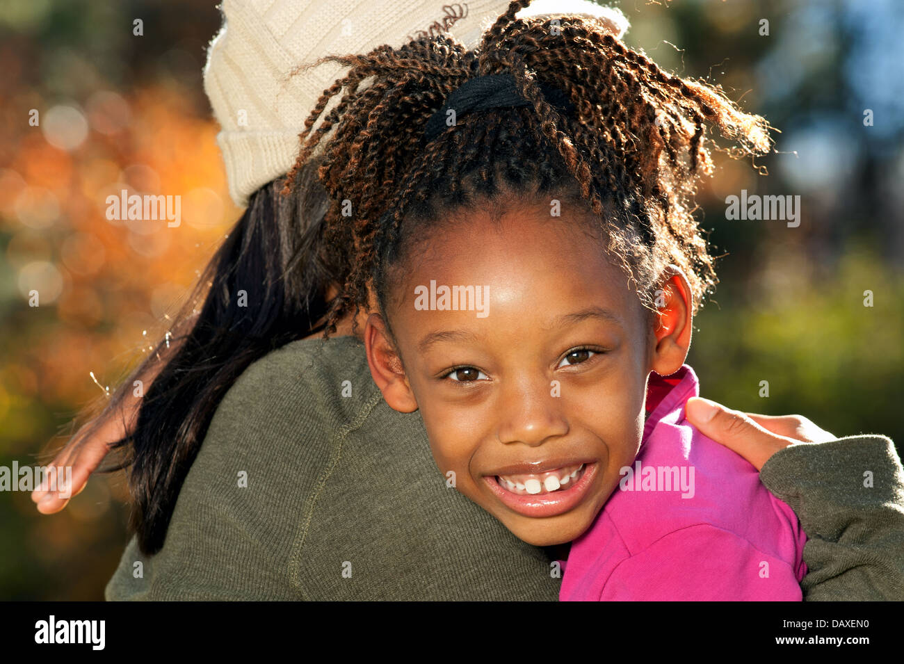 African American mother and child having fun spending time together in a park Stock Photo