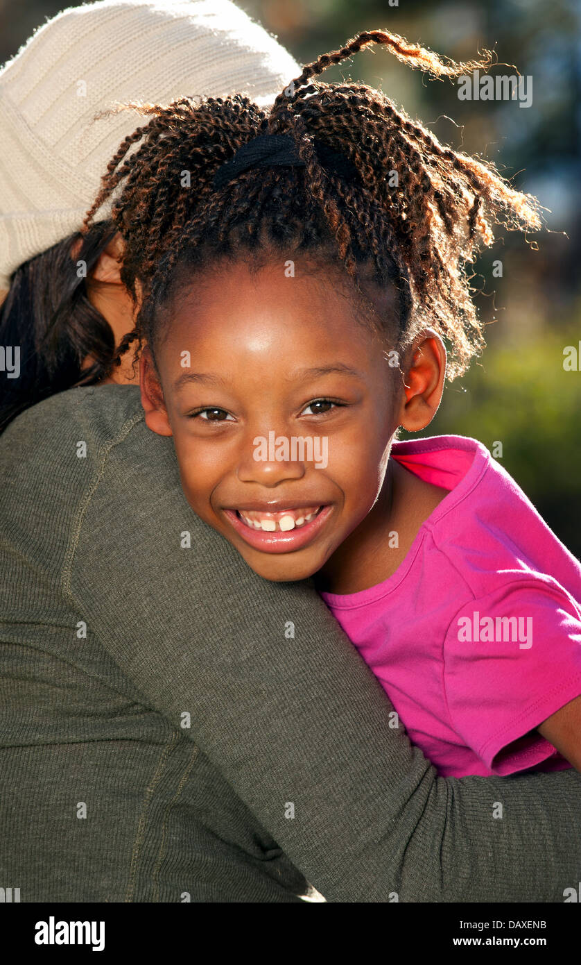 African American mother and child having fun spending time together in a park Stock Photo