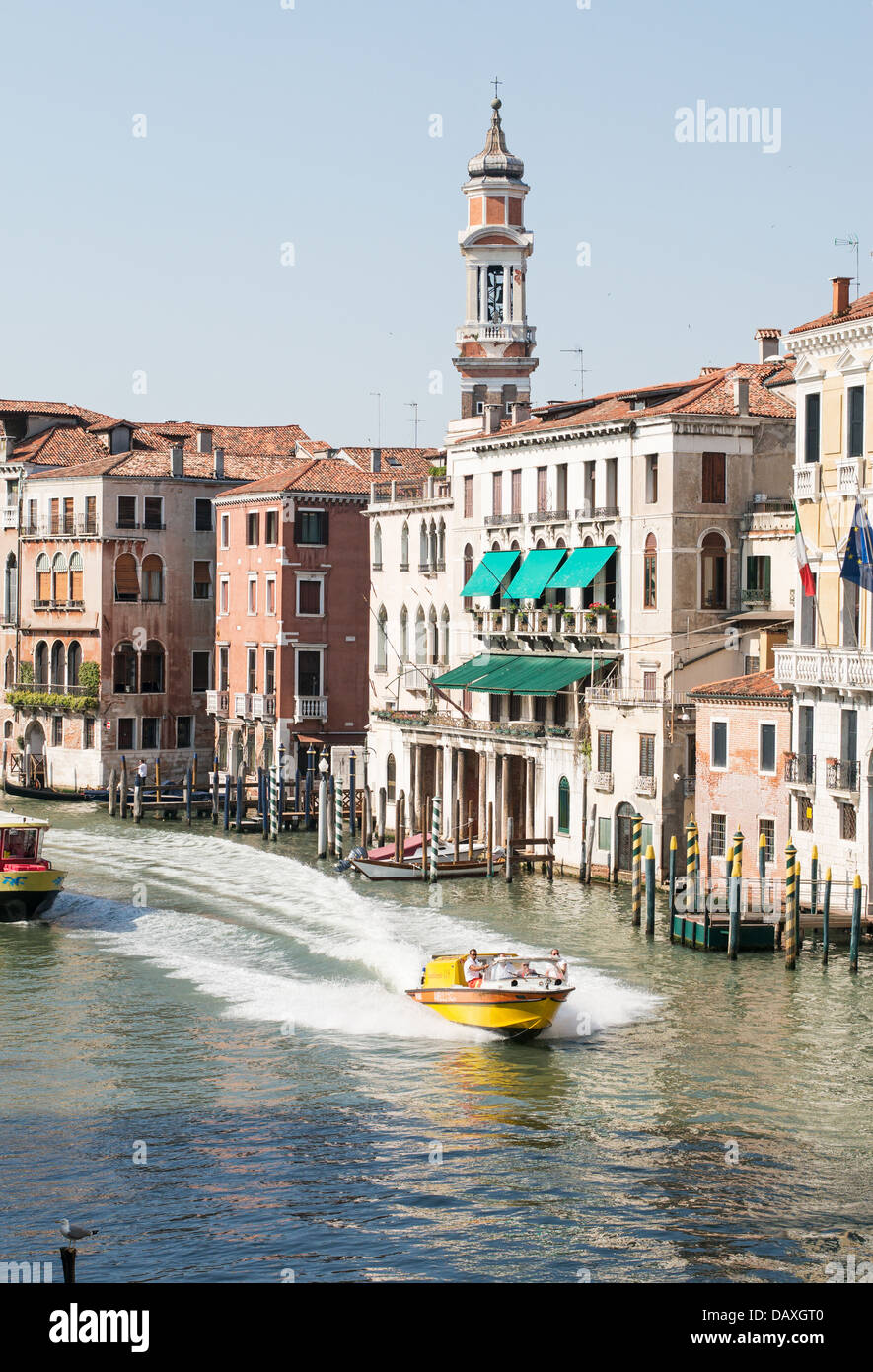 A water  ambulance speeds along the Grand Canal Venice, as seen from the Rialto Bridge Stock Photo