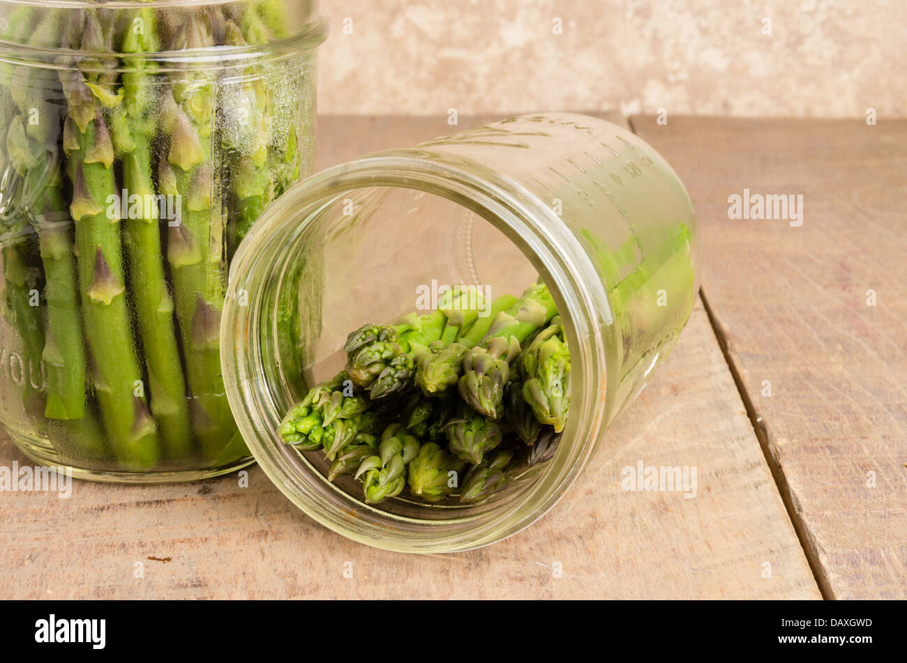 Fresh asparagus being preserved with pickling Stock Photo