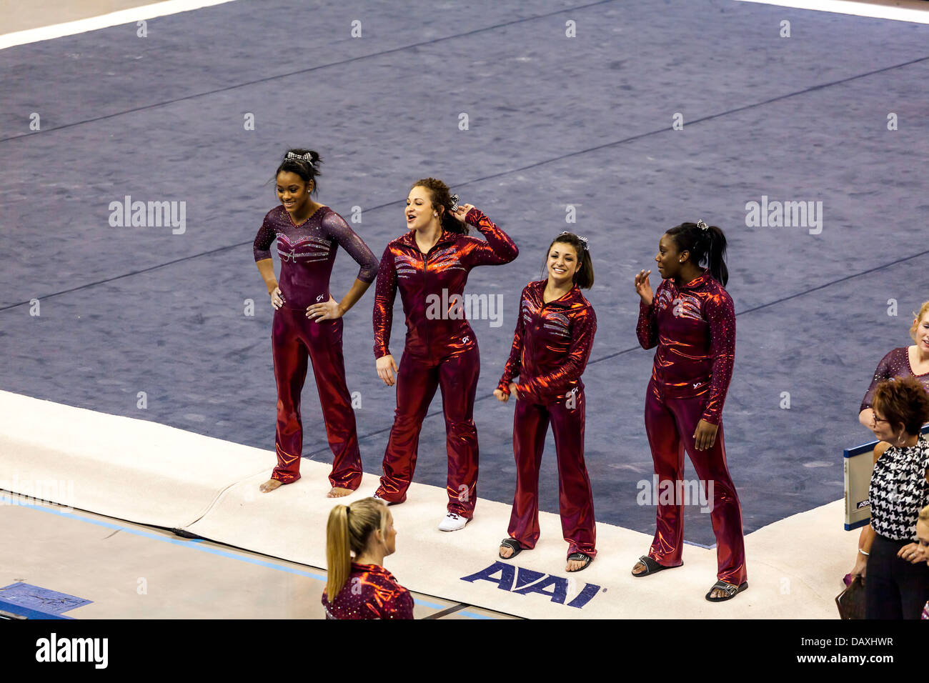 Alabama Crimson Tide women's gymnastics team cheer on fellow competitor during meet with University of Florida (2-8-13). Stock Photo