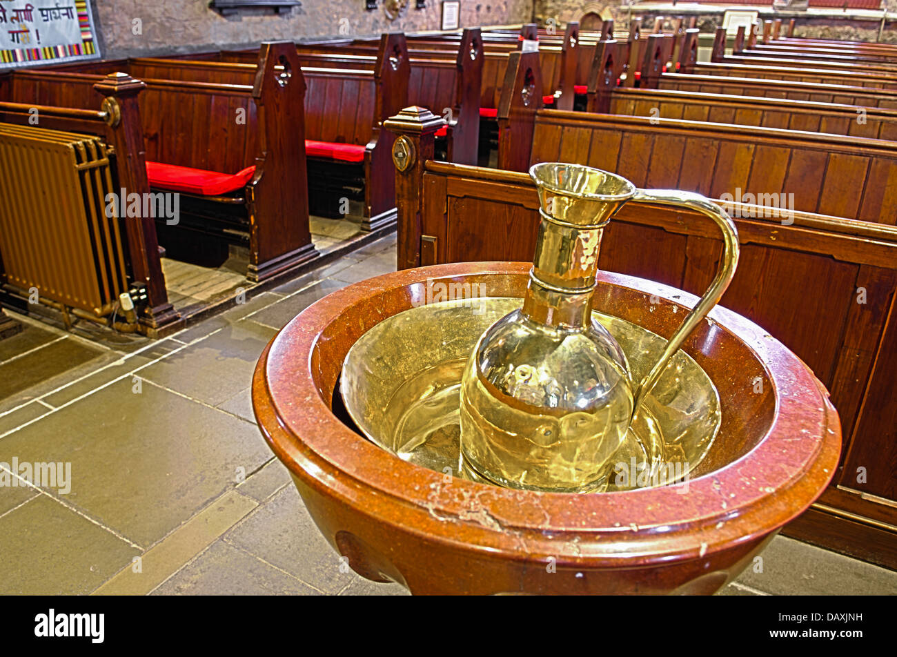 Brass jug and bowl inside Saint Nicholas Church of Ireland, Carrickfergus, which dates back to around 1182 Stock Photo