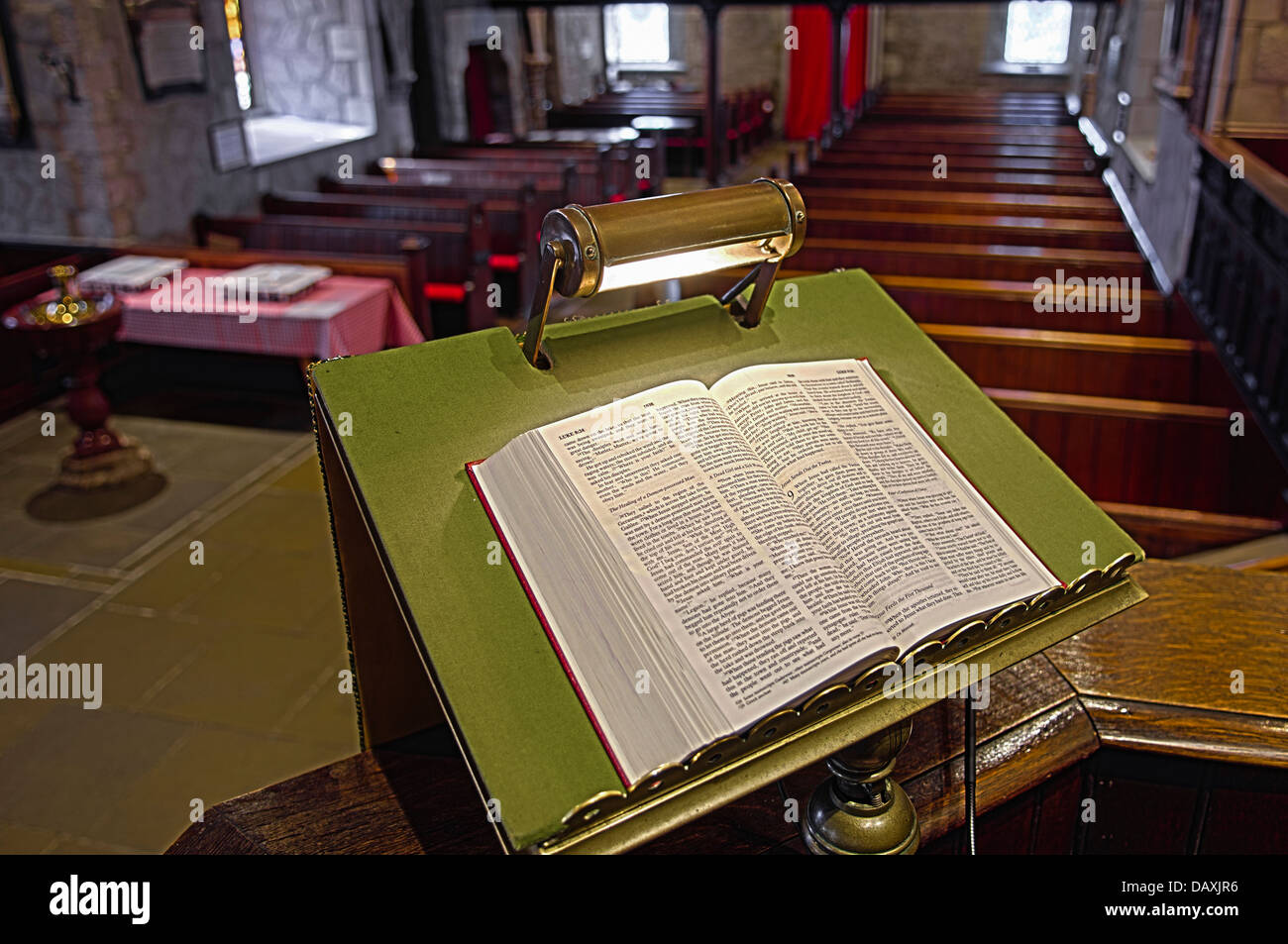 Bible on a lecturn inside Saint Nicholas Church of Ireland, Carrickfergus, which dates back to around 1182 Stock Photo