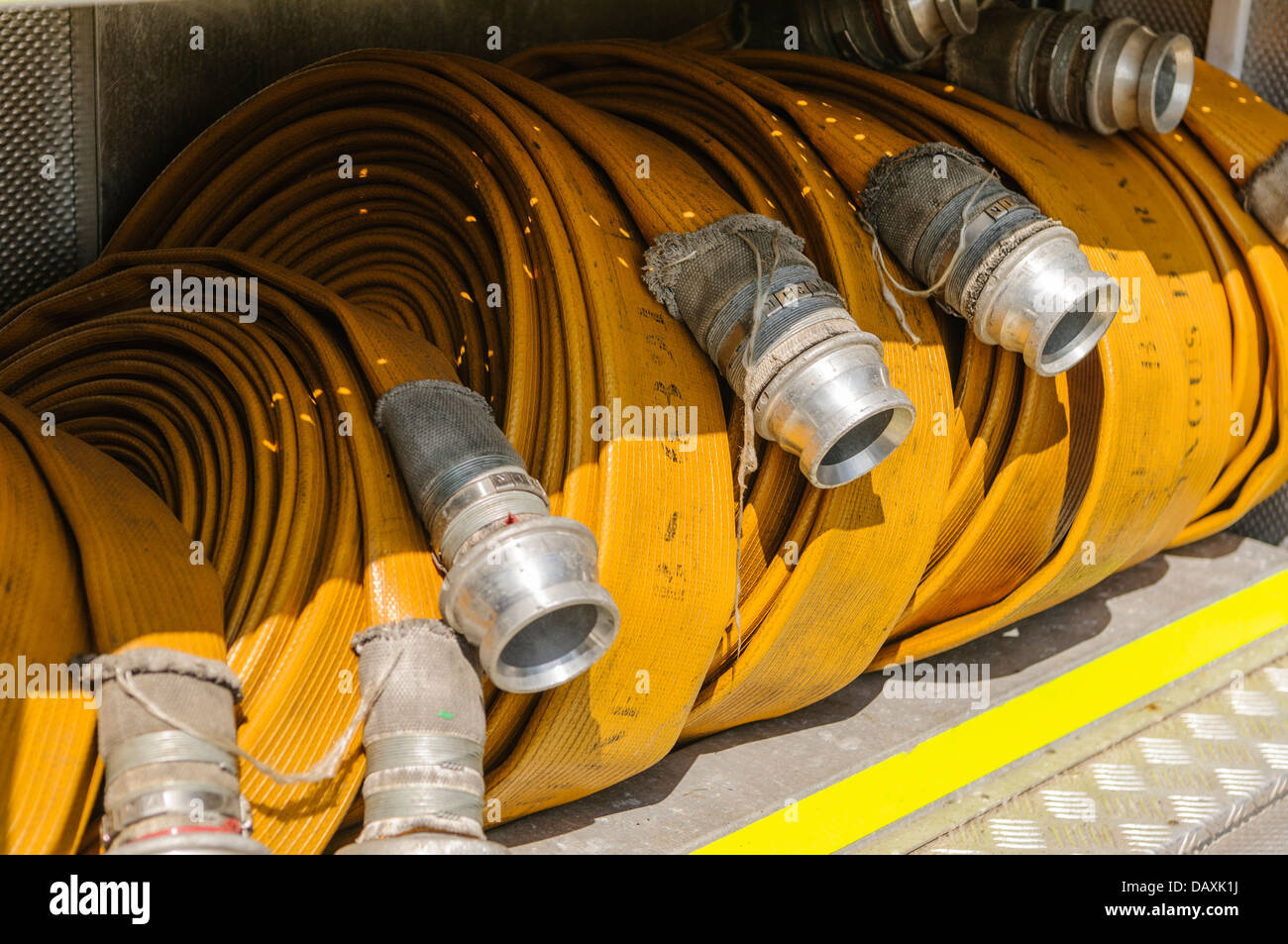 Hosepipes on the back of a fire engine Stock Photo