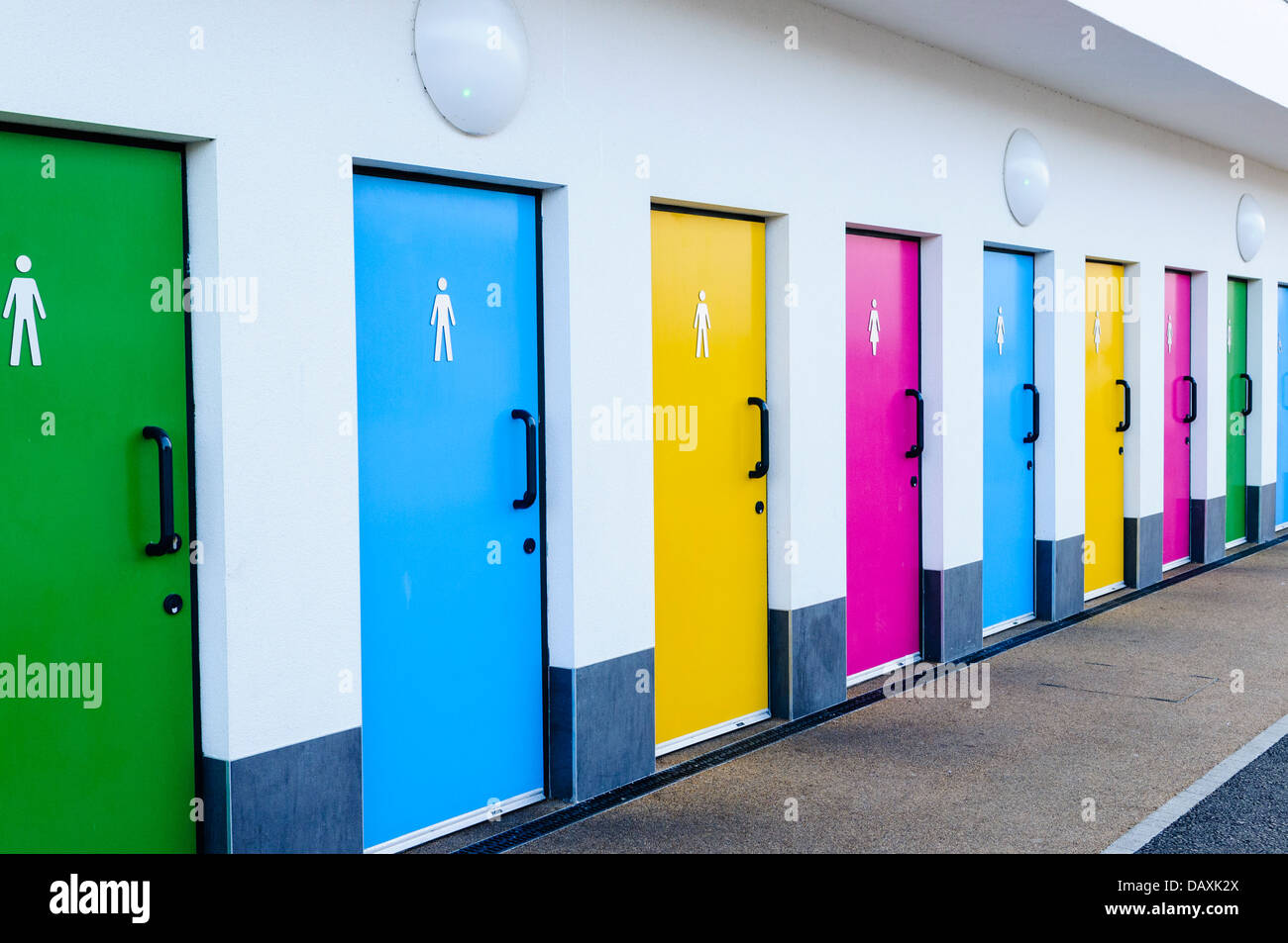 Brightly coloured public toilet doors Stock Photo