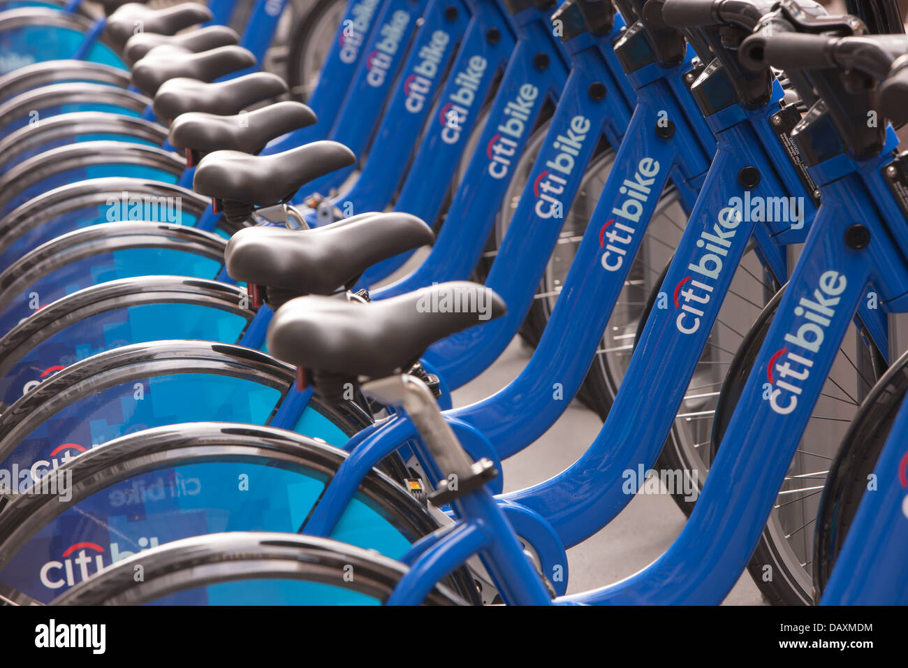 Public bicycles of the Citi Bike NYC bike sharing program wait in their