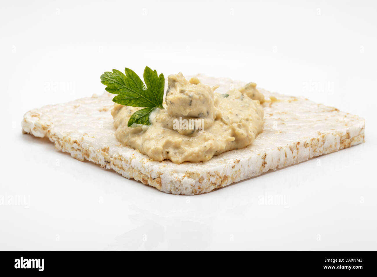 Square rice cakes topped with houmous Stock Photo