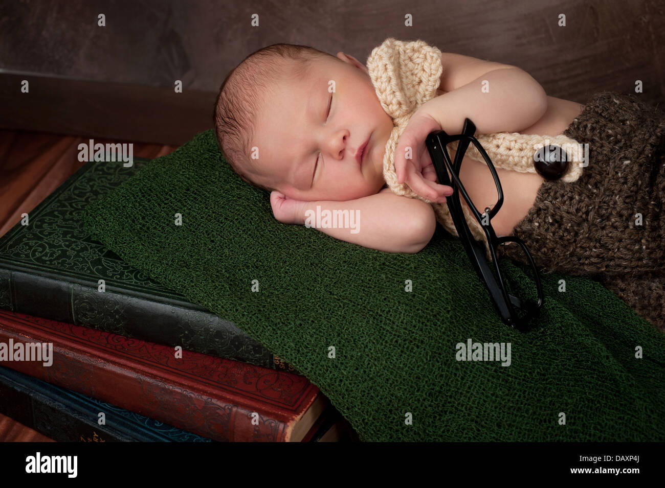 Newborn Baby Boy with Books and Reading Glasses Stock Photo