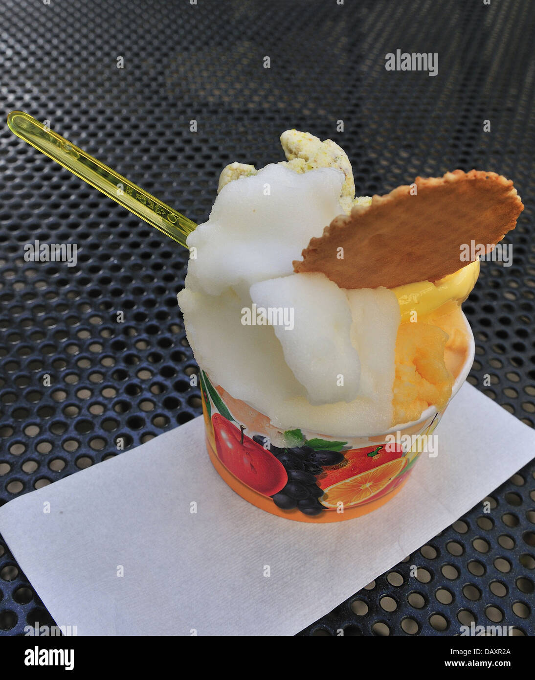 Gelato and sorbet with wafer in tub on a table bought from an Ice cream parlor Otranto, Southern Italy Stock Photo