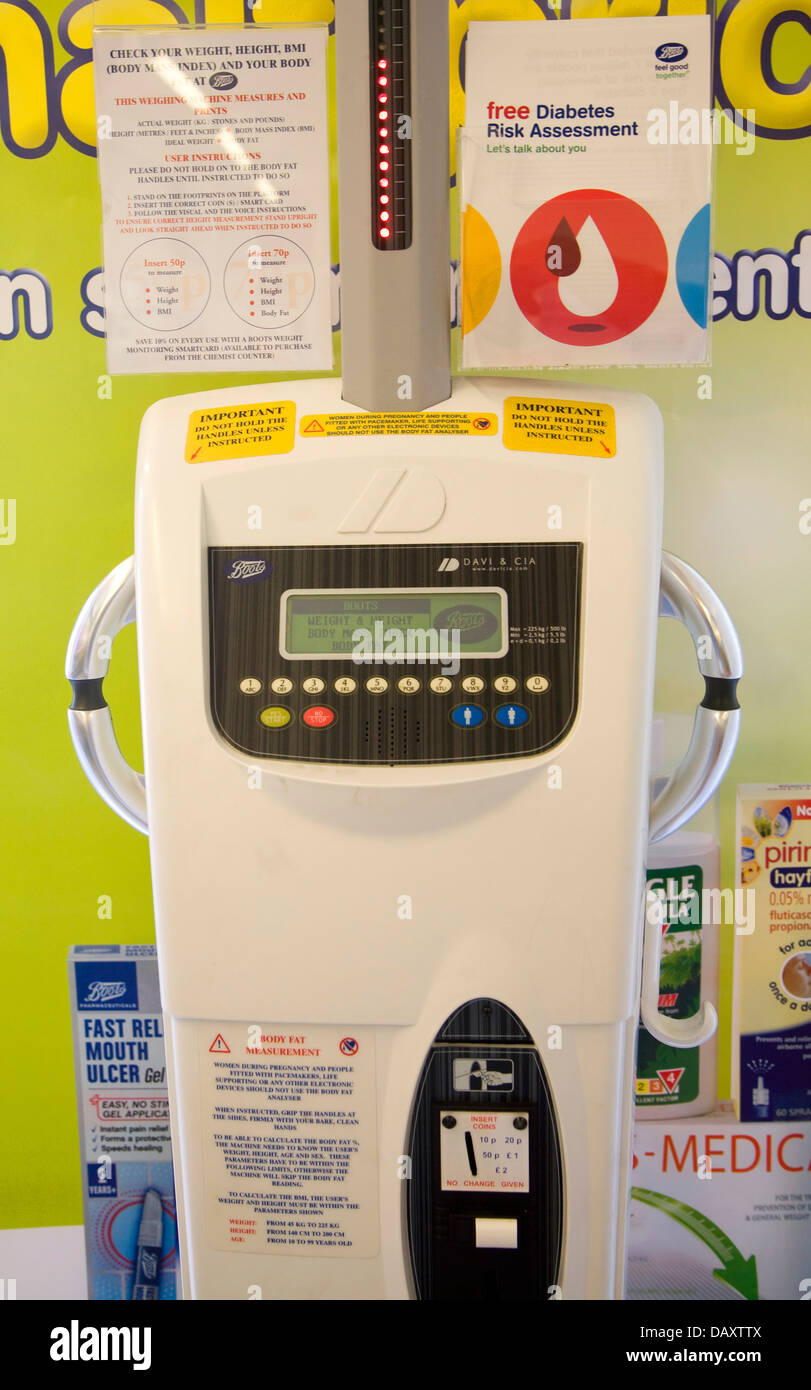 Health check machine weight BMI weighing machine Boots shop, UK Stock Photo  - Alamy