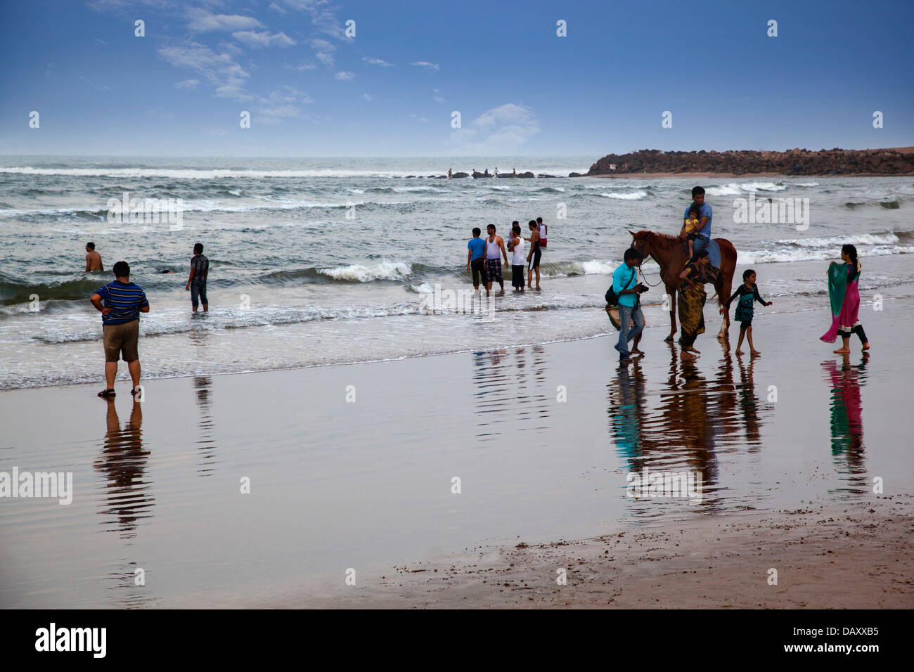 Tourists enjoying on the beach, Rishikonda Beach, Vishakhapatnam, Andhra Pradesh, India Stock Photo