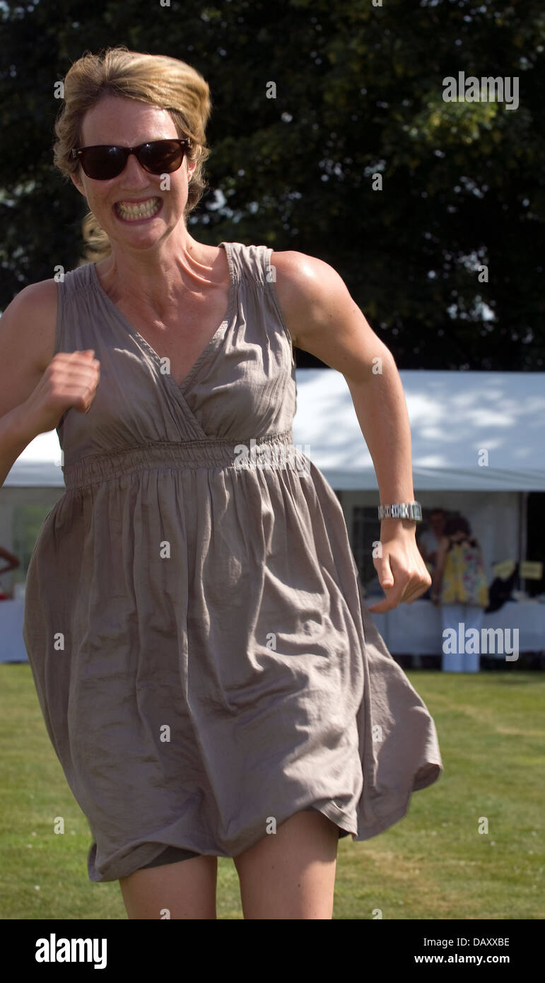 Woman taking part in adult race at Worldham Village Fete, Hampshire, UK. Sunday 14 July 2013. Stock Photo