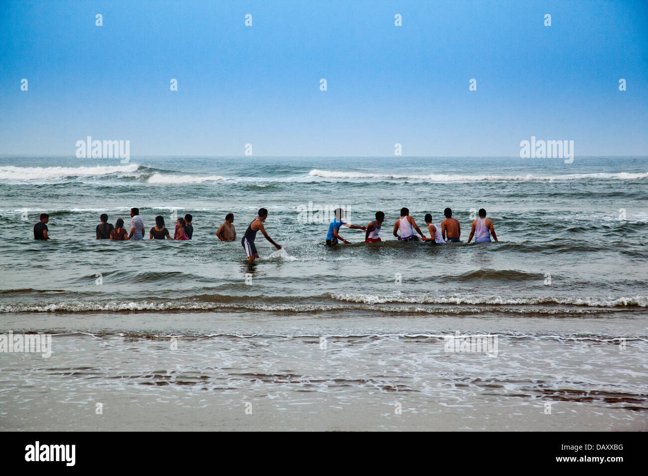 Tourists enjoying on the beach, Rishikonda Beach, Vishakhapatnam, Andhra Pradesh, India Stock Photo