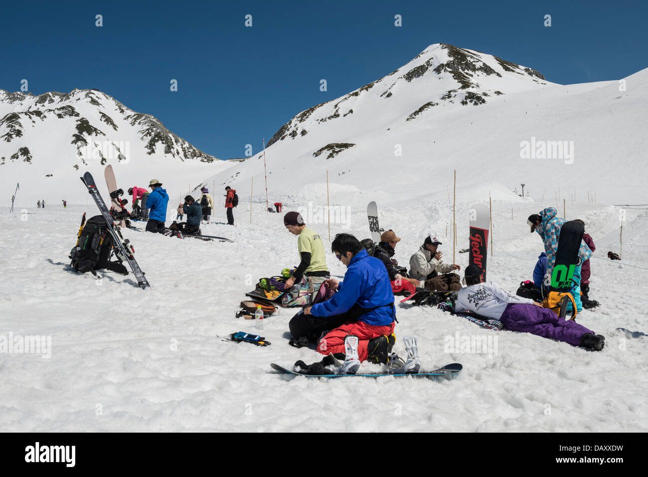 Snowboarders and Skiers taking a break on Mt. Kunimi, Murodo, Japan Stock Photo