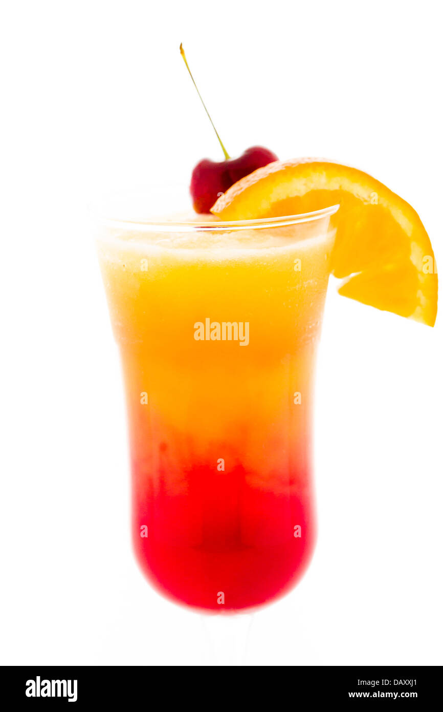 Tequila sunrise cocktail with orange wedge and cherry as a garnish