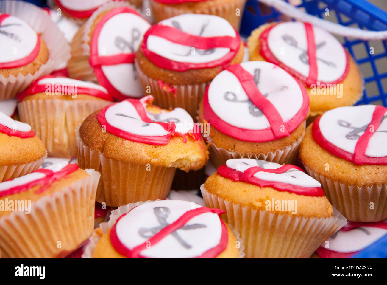 London, UK. 20th July, 2013. Cakes on offer to protesters as UK Uncut hold demonstrations outside two London branches of HSBC in protest against what they say is tax dodging by the bank, as welfare cuts drive more people to reliance on foodbanks. Credit:  Paul Davey/Alamy Live News Stock Photo