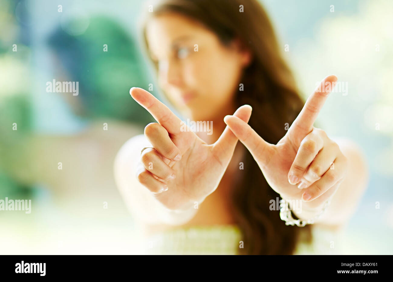 Girl making 'Whatever' gesture Stock Photo Alamy