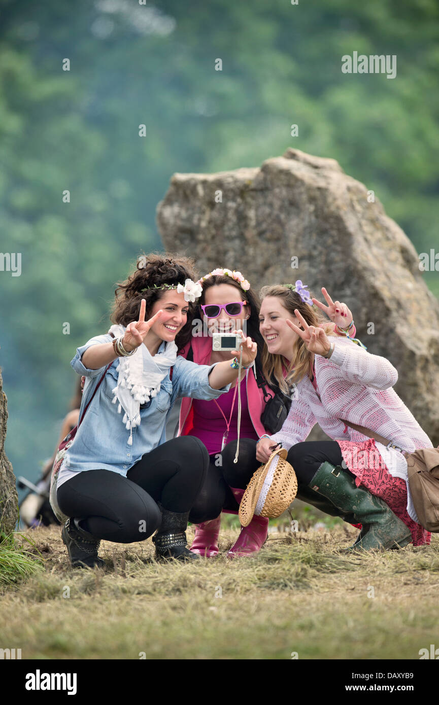 Glastonbury Festival 2013 A group of girls record the moment at the stone circle UK Stock Photo