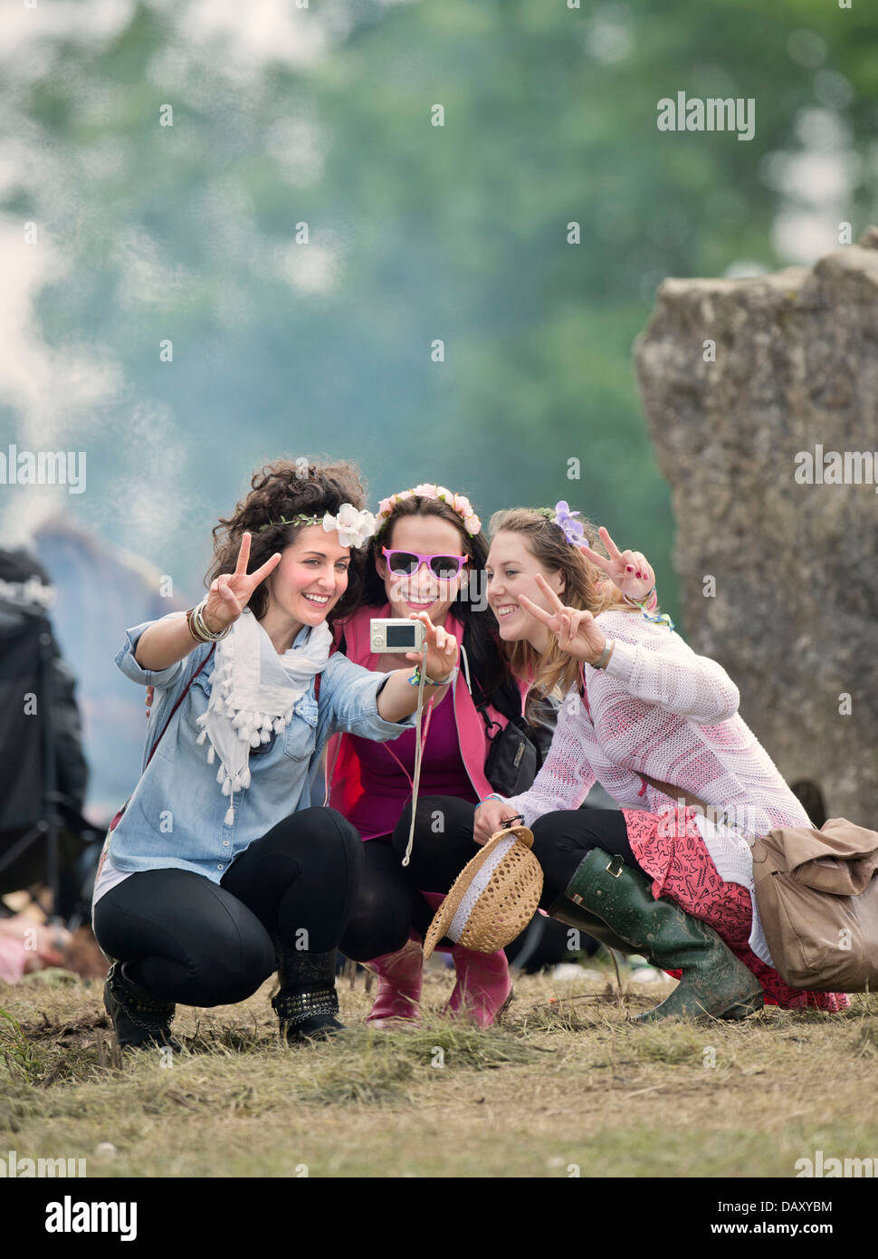 Glastonbury Festival 2013 A group of girls record the moment at the stone circle UK Stock Photo