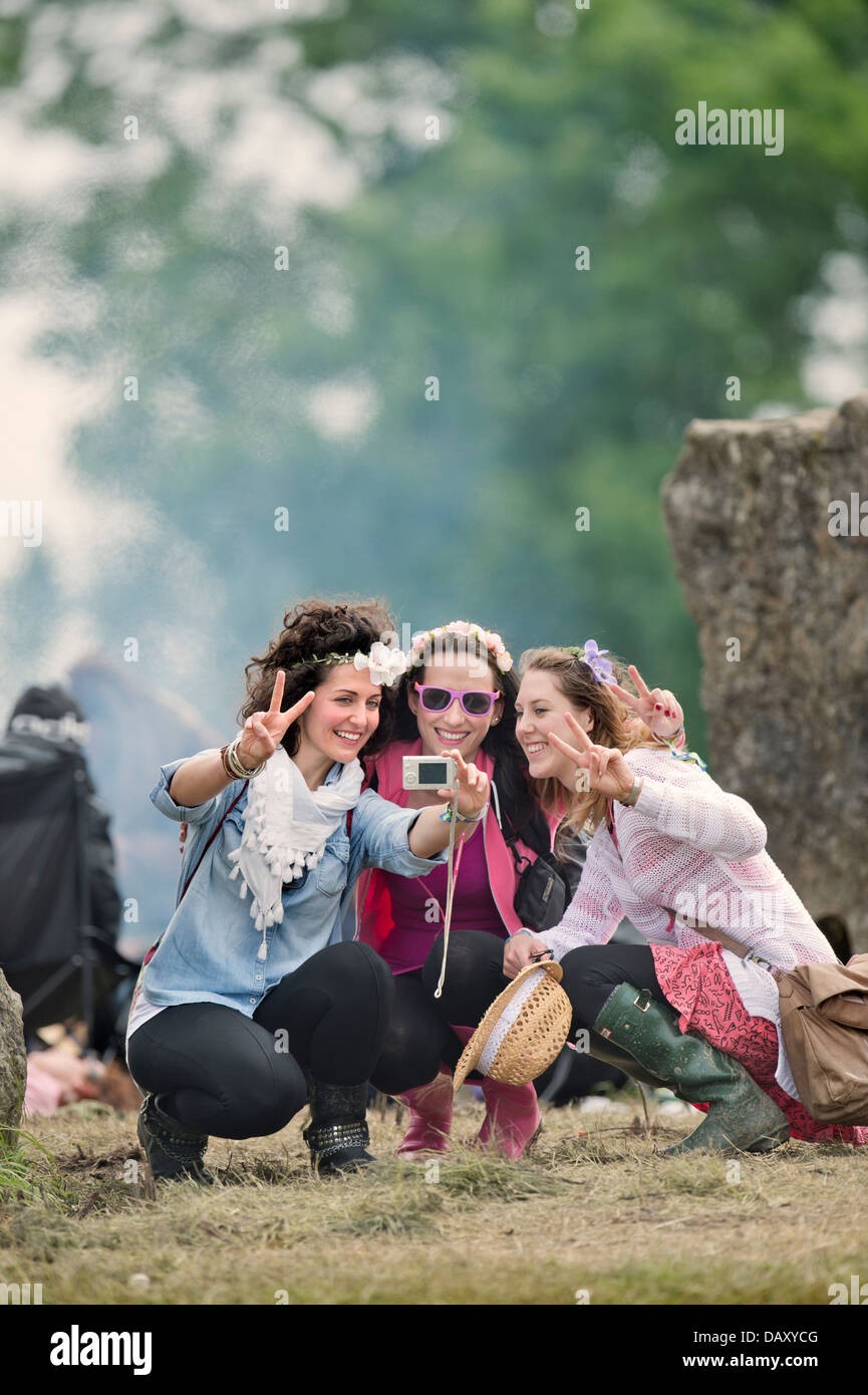 Glastonbury Festival 2013 A group of girls record the moment at the stone circle UK Stock Photo