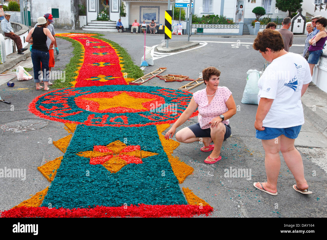 Local residents making flower carpets in the parish of Ponta Garça. Sao Miguel island, Azores. Stock Photo