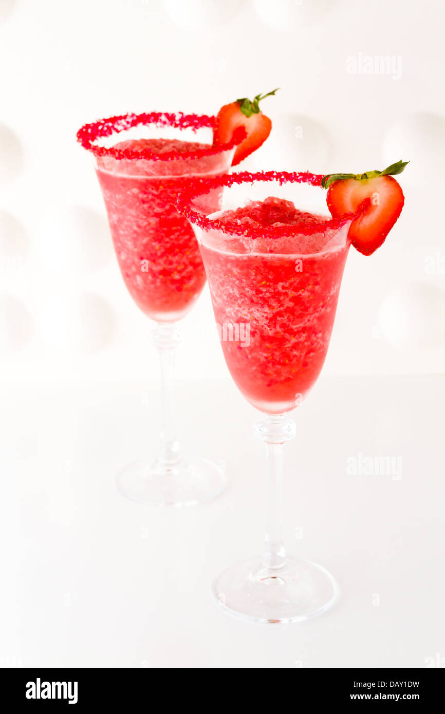 Strawberry daiquiri cocktail with strawberry and lime as a garnish
