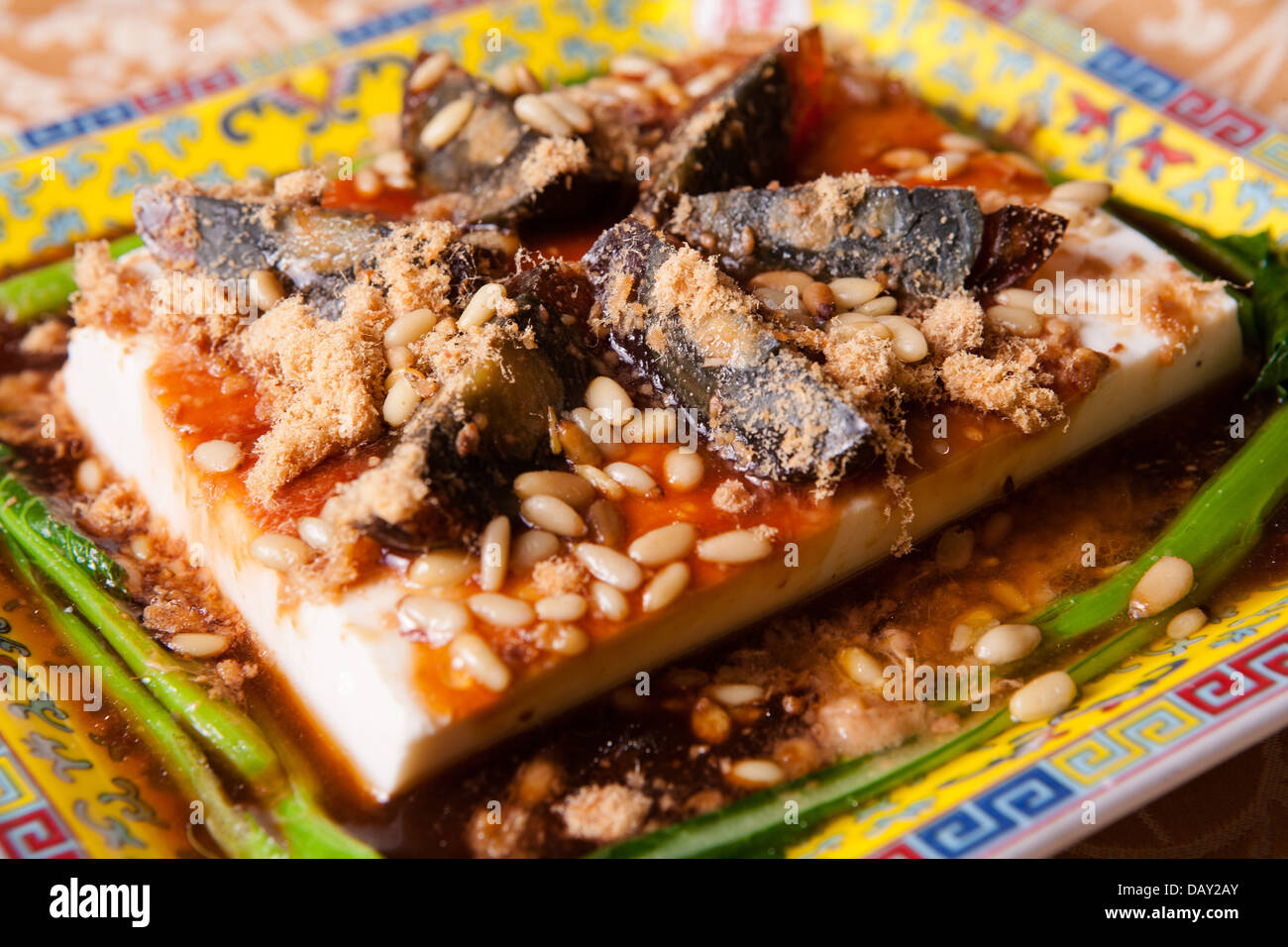 eggs covered in tofu and spinach on a plate Stock Photo Alamy