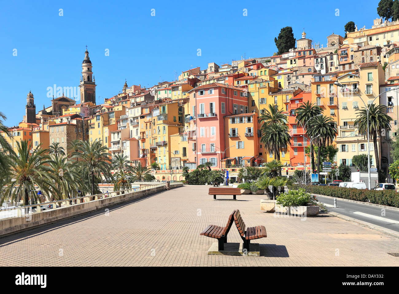 View of promenade and old medieval town with multicolored houses of Menton on French Riviera in France. Stock Photo