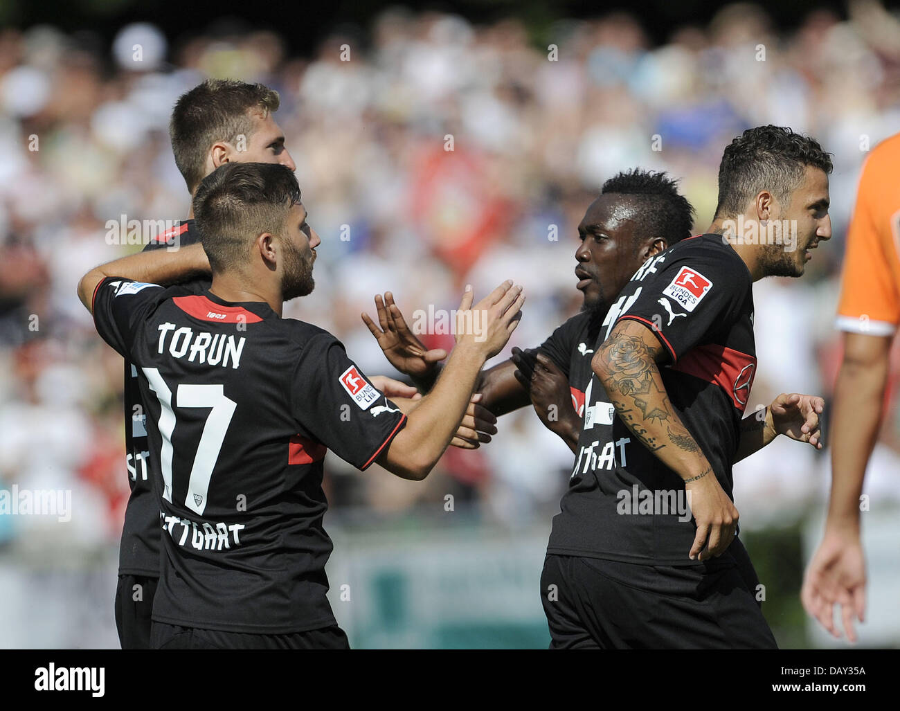 Ludwigsburg, Germany. 20th July, 2013. Stuttgart's Daniel Schwaab (L-R), Torun Tunay, Arthur Boka and Sercan Sararer celebrate after the 1-0 goal during the test match between VfB Stuttgart and FC Valencia at Ludwig-Jahn-Stadium in Ludwigsburg, Germany, 20 July 2013. Photo: DANIEL MAURER/dpa/Alamy Live News Stock Photo