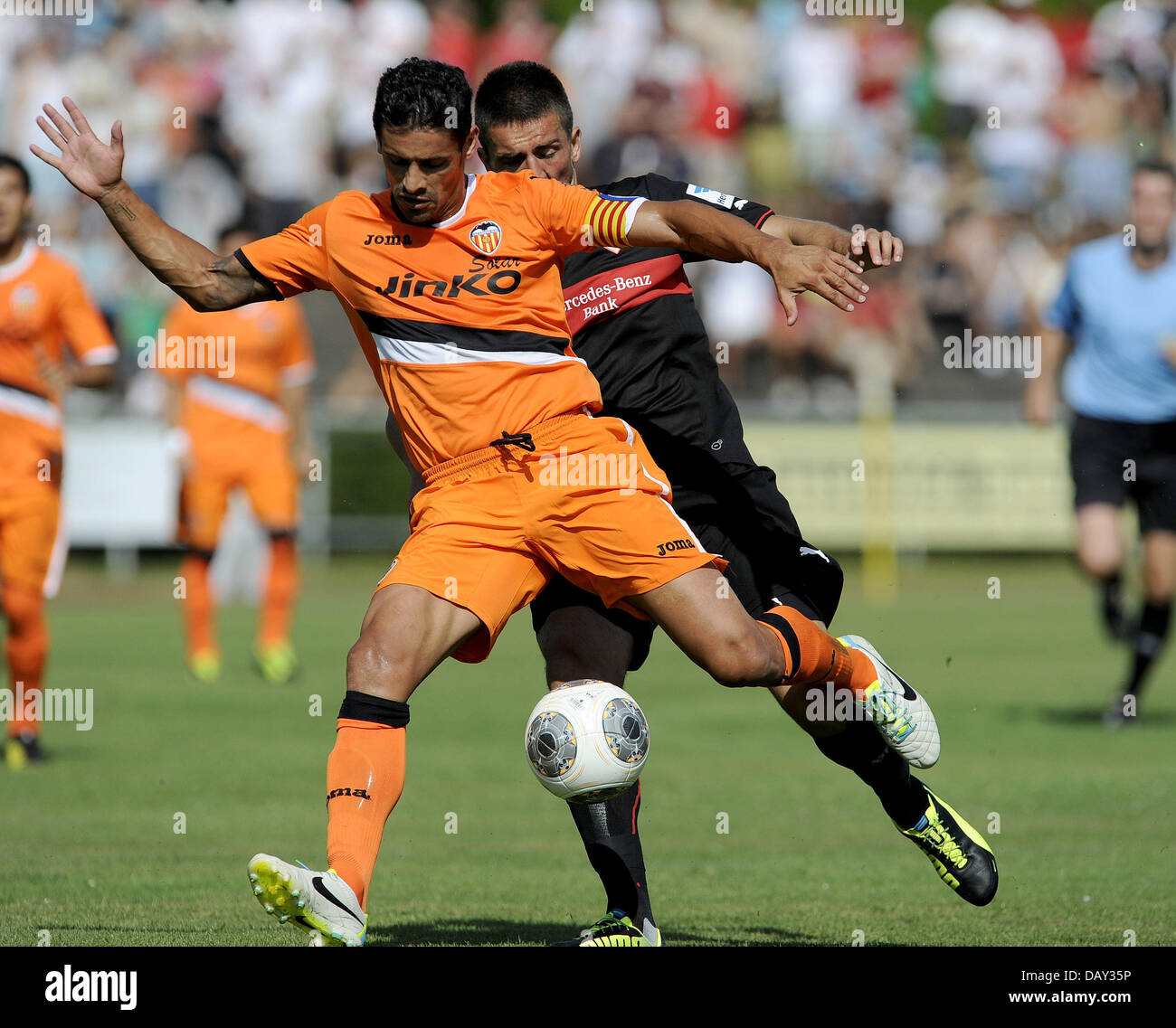 Ludwigsburg, Germany. 20th July, 2013. Stuttgart's Vedad Ibisevic (back) vies for the ball with Valencia's Ricardo Costa during the test match between VfB Stuttgart and FC Valencia at Ludwig-Jahn-Stadium in Ludwigsburg, Germany, 20 July 2013. Photo: DANIEL MAURER/dpa/Alamy Live News Stock Photo