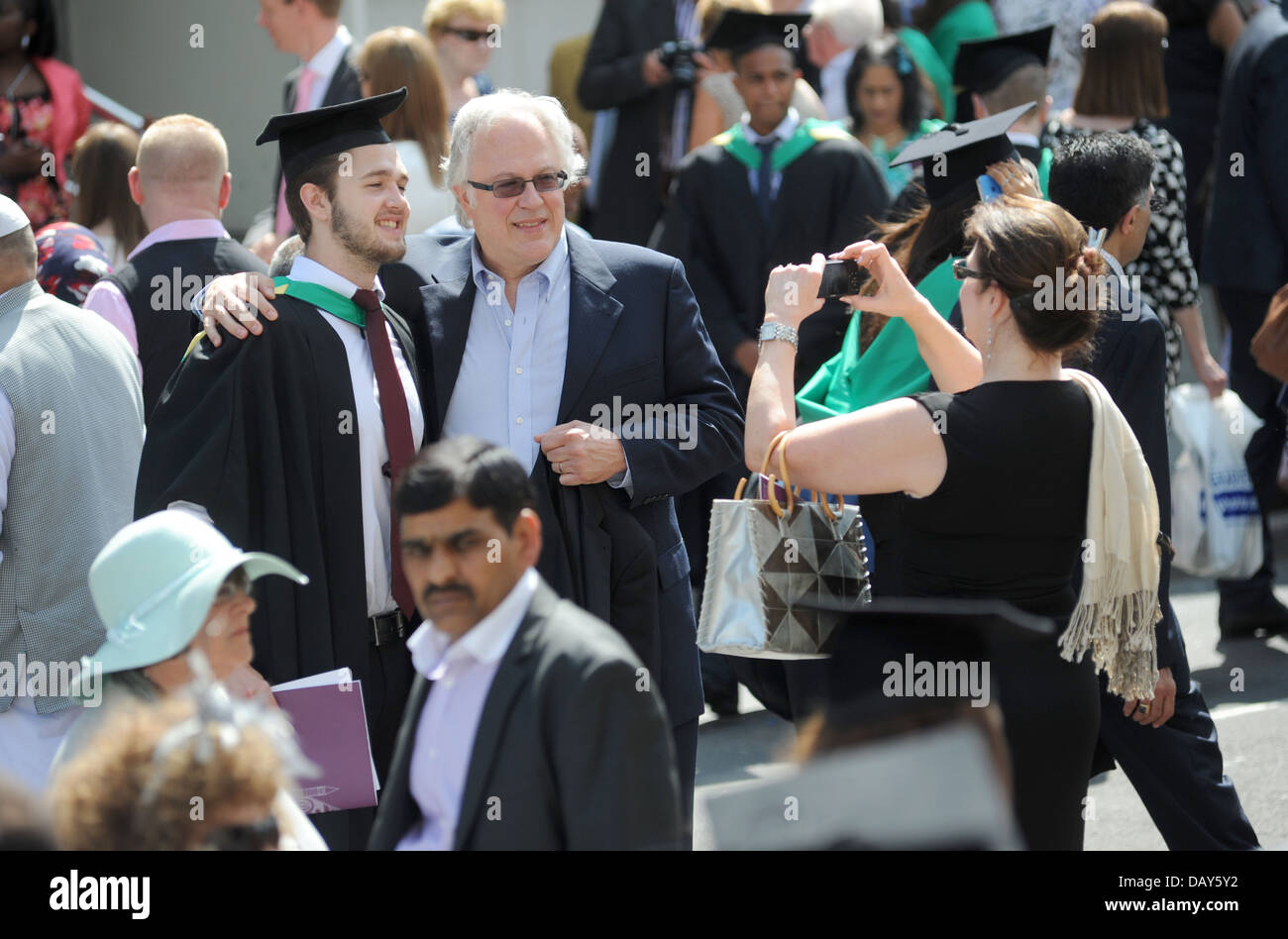STUDENT  AT A BRITISH UNIVERSITY CELEBRATING ON GRADUATION DAY RE EDUCATION DEGREES LOANS STUDENT JOBS CAREERS FOREIGN UK Stock Photo