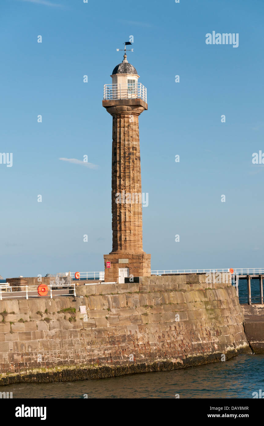 Great Britain, England, North Yorkshire, Whitby, River Esk, harbour entrance sea wall, lighhouse Stock Photo