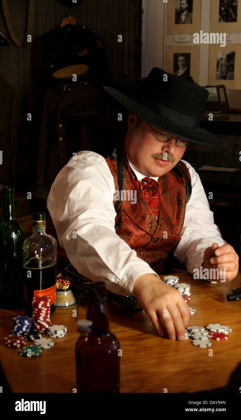 A man placing a bet in an old west poker game Stock Photo - Alamy