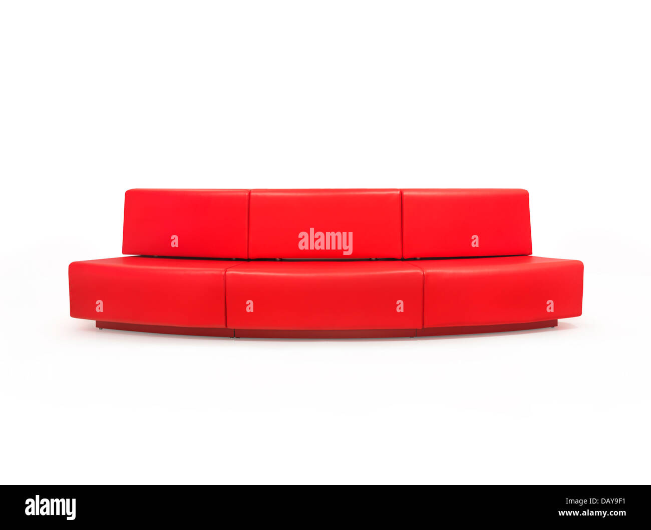 Long red couch isolated on white background with clipping path Stock